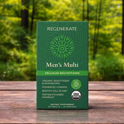 A green box of Regenerate Men's Multi Cellular Multivitamin standing on a wooden surface with a blurred forest background.